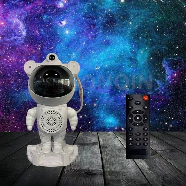 Інтерактивні іграшки - Нічник проектор зоряного неба Астронавт з BT колонкою та різними проекціями